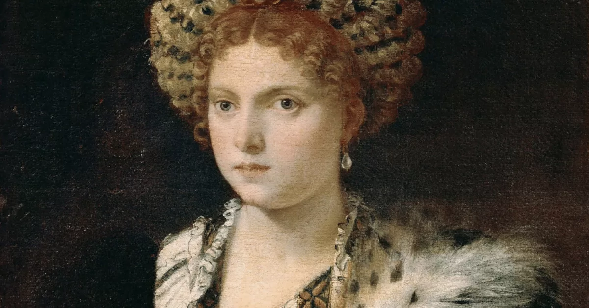 Portrait of Isabella d'Este. She's dressed in an opulent dress and furs with pearl earrings.