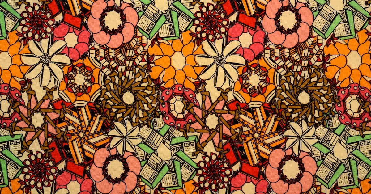 Vintage 1960s fabric. Multicolored material in orange, green, black, pink, and brown.
