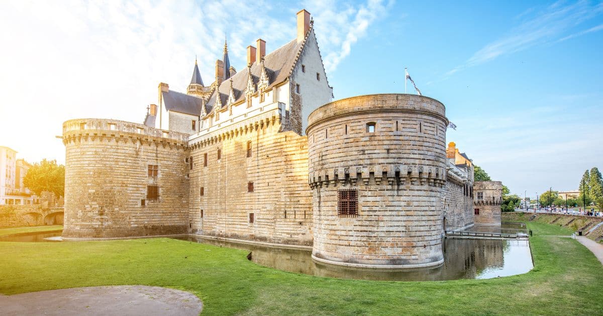 The Castle of the Dukes of Brittany in Nantes, France, at sunset.
